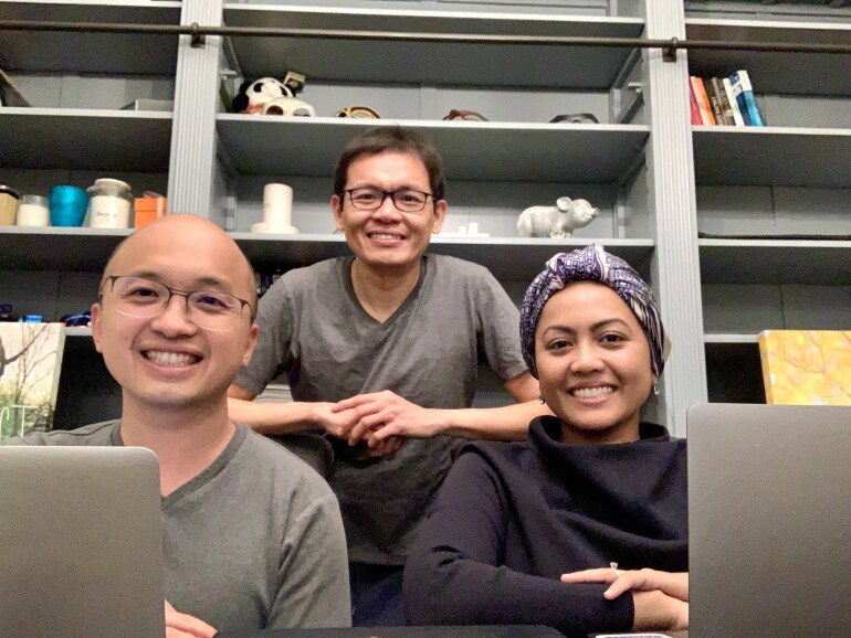 Pantas Co-Founders Eong, Max and Syaheedah sitting at a table with their laptops